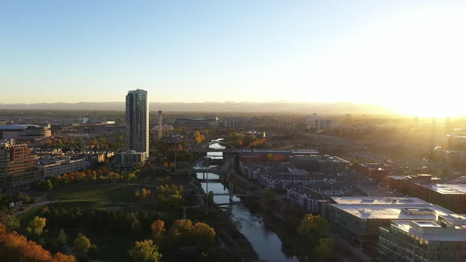Wide aerial view across Front Range residential rooftops